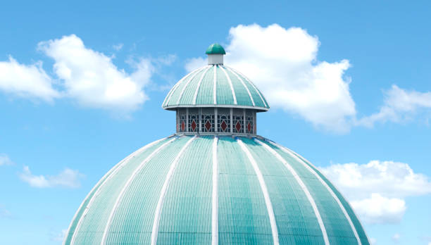 Green mosque roof on blue sky background