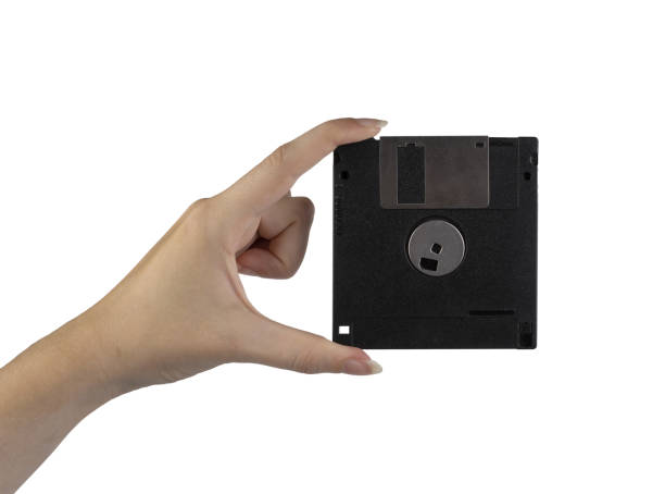 istock an old floppy disk in the female hand 1423865364