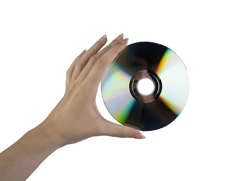 a compact disk in the female hand on a white background