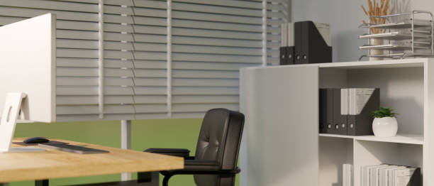 istock Modern office workplace interior design with computer desk, office chair, files storage cabinet 1423868219