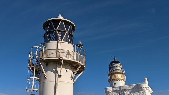 White lighthouses against blue sky