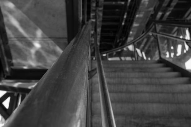 Wooden handrail and a cement staircase