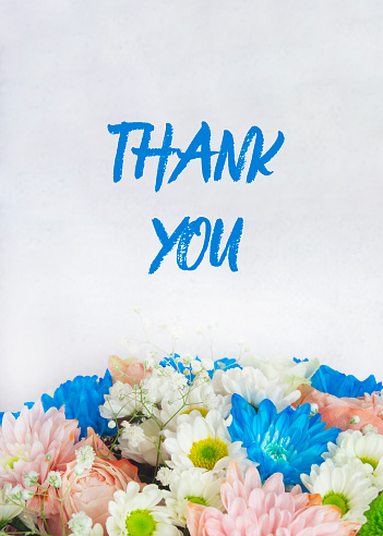 The postcard is horizontal. A bouquet with multicolored flowers and the inscription thank you. The flowers are white, pink and blue. Card for congratulations, thanksgiving and invitations