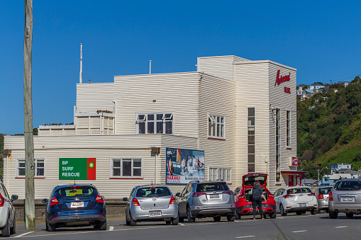 Wellington, New Zealand - August 13, 2022: Cars parked outside of Maranui cafe in Lyall Bay in Wellington, New Zealand