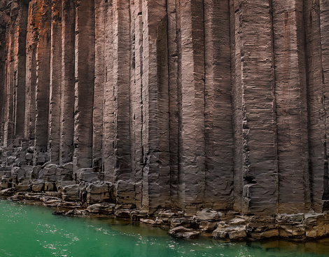 Hexagon basalt Columns with green river flowing, Stuðlagil Studlagil Canyon, Iceland