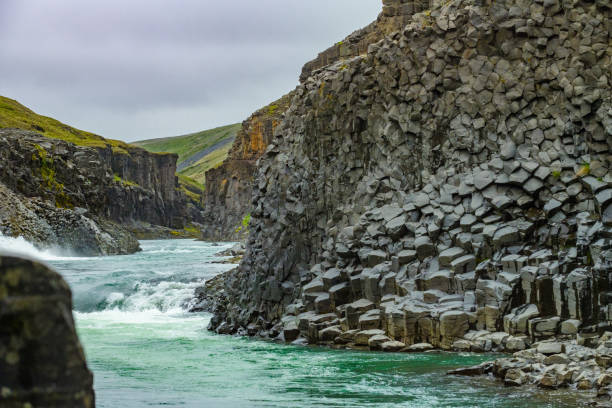 Impressive Studlagil Canyon with rushing green coloured river, Iceland
