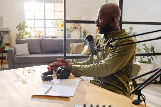 istock Young confident black man in casualwear explaining something during speculation 1423887848