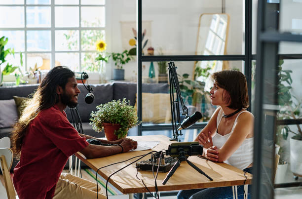 istock Happy young man and woman looking at one another during interview 1423887961