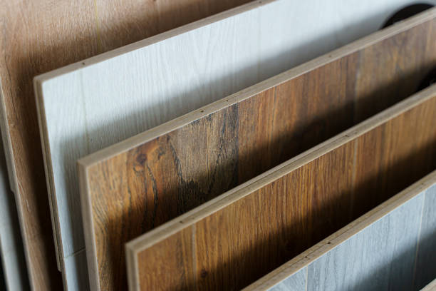 istock Laminate background. Samples of laminate or parquet with a pattern and wood texture for flooring and interior design. Selected focus Production of wooden floors.. 1423888832
