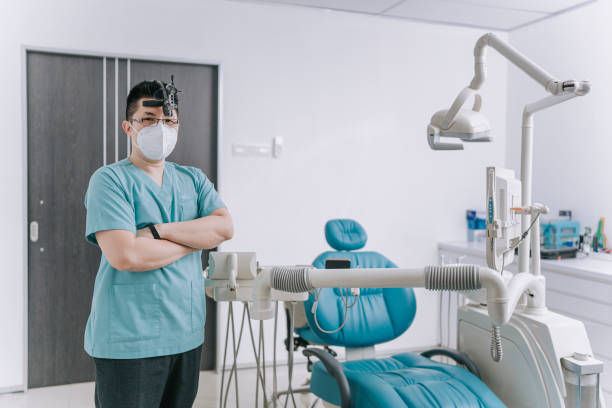portrait proud confidence asian chinese male dentist looking at camera smiling in dentist