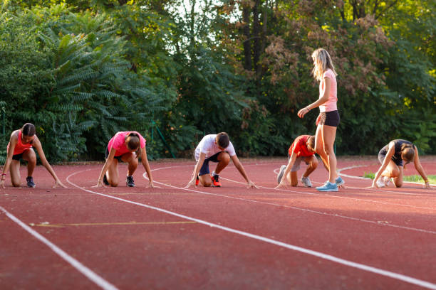 istock Athletes At Race Starting Line Ready To Run 1423897547