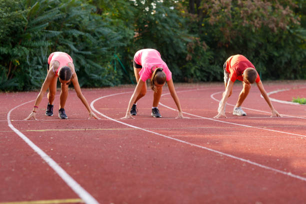 istock Athletes At Race Starting Line Ready To Run 1423897550