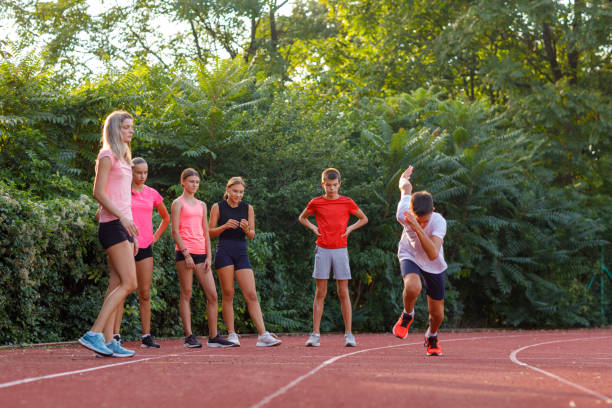 istock Athletes At Race Starting Line Ready To Run 1423897573