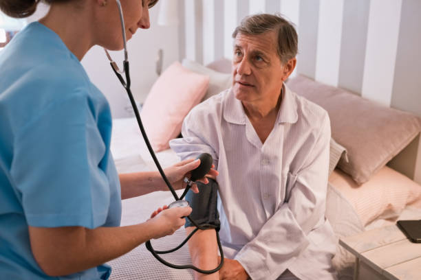 istock Nurse checking blood pressure 1423923923
