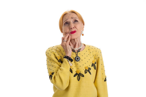 istock Old woman having toothache. 1423925800