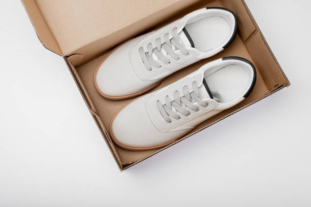 istock One white casual sneakers in a brown cardboard box 1423926412