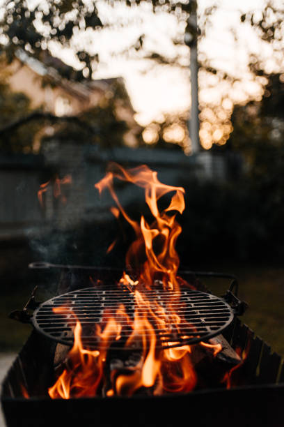 Bbq grill with fire on backyard nobody
