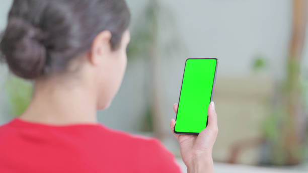 istock Indian Woman Using Smartphone with Green Screen 1423933320