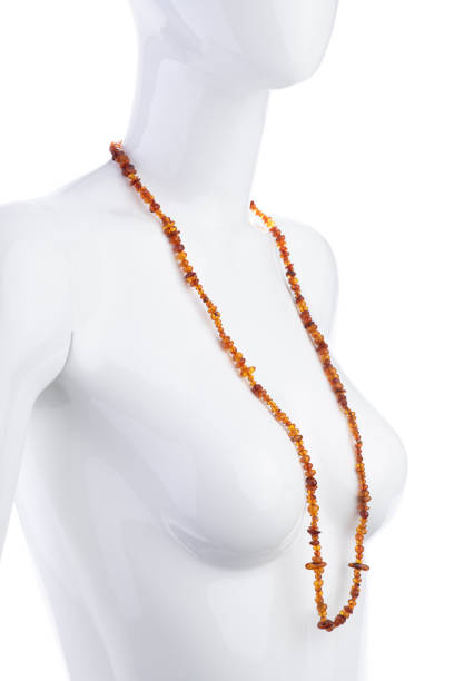 istock Raw amber beads isolated on white background 1423934590
