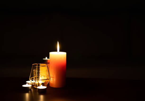istock Burning candle in the dark 1423935405