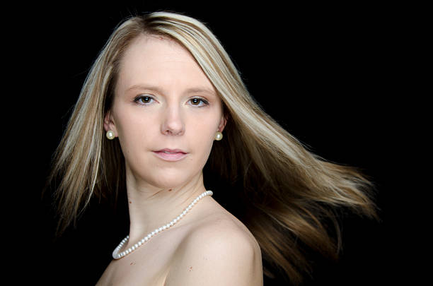 The woman smiling at the camera.