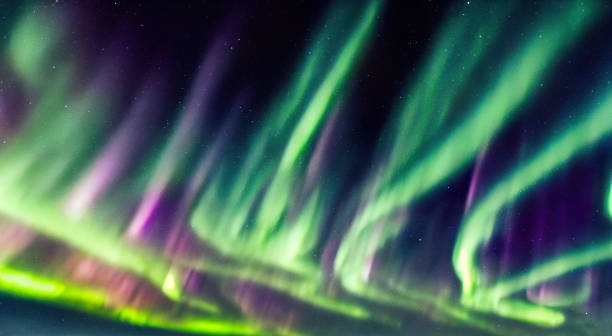 istock The northern lights aurora borealis over dark starry sky 1423939850