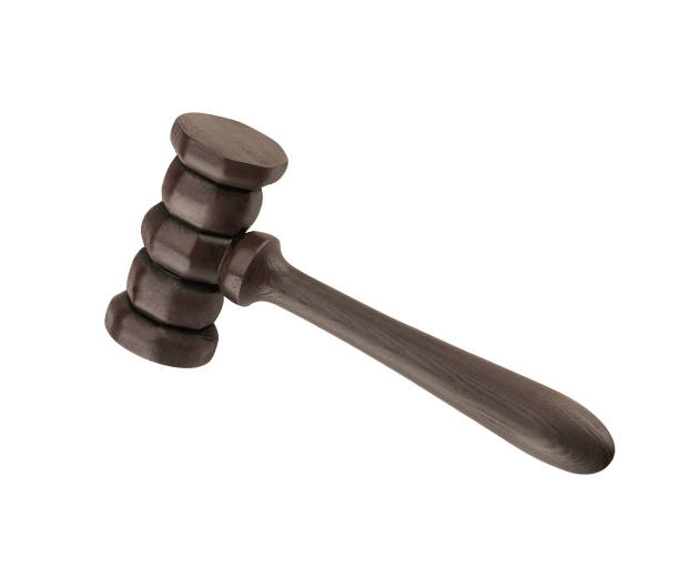 istock Wooden justice gavel and block with brass 1423944277