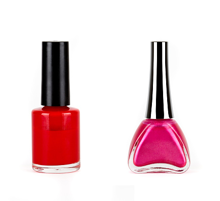 red with pink nails polish bottles on white background
