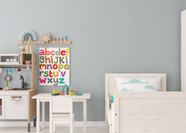 istock Empty wall in modern child room. Mock up interior in scandinavian style. Copy space for your picture or poster. Bed, table and chair, toys. Cozy room for kids. 3D rendering. 1423947599