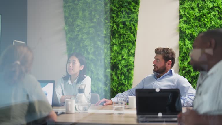 Business people having business meeting in meeting room in modern office working space