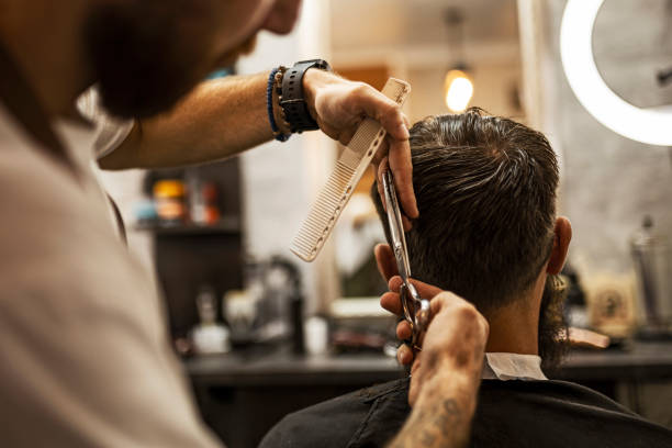 istock Young man in barber shop 1423950544