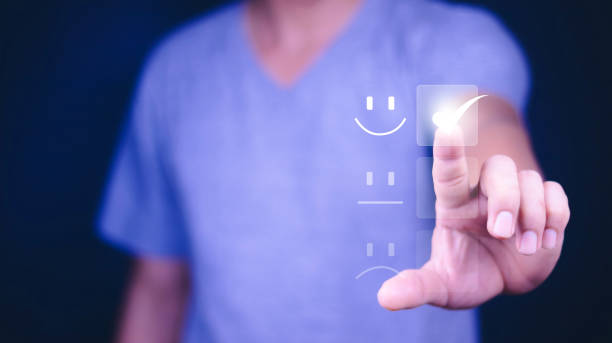 istock Customer Service and Satisfaction Concept Businessman is touching the virtual screen on the happy Smiley face icon to satisfy the service. Rating Very impressed. 1423951678