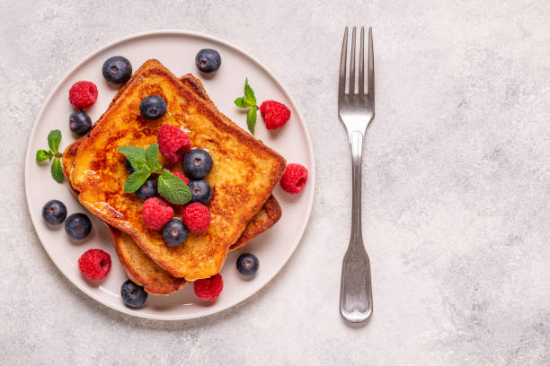 istock French toast with blueberries, raspberries, maple syrup 1423951933