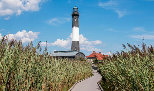 Red and whitr striped lighthouse and clear blue sky on island Sylt, Germany