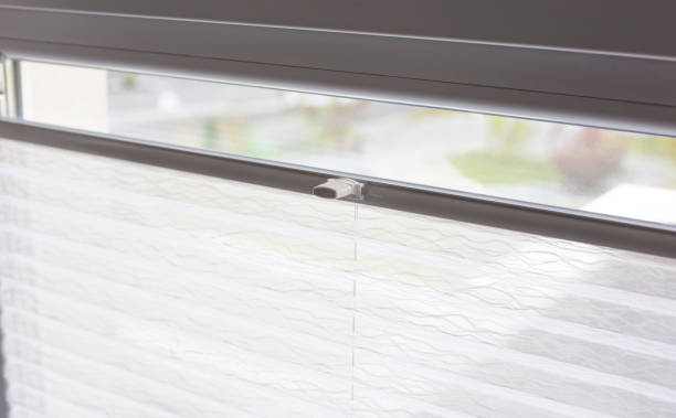istock Pleated blinds close up on the window in the interior 1423953794