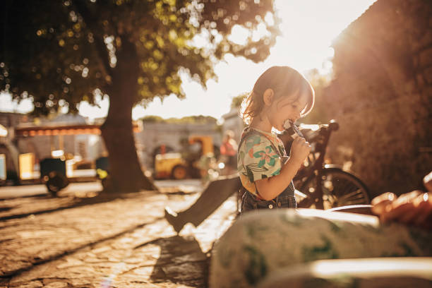 Funny kid is eating ice cream