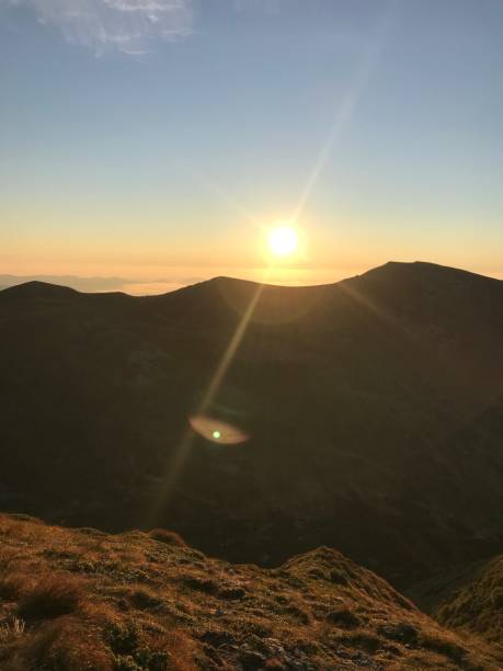 istock Meet Sunrise at the Mountain Peak 1423960749