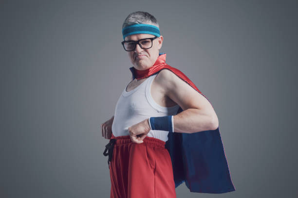 istock Funny confident superhero looking at camera 1423961800