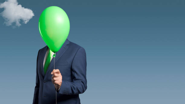 istock Anonymous businessman with a balloon in front of his head 1423965149