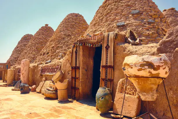 Traditional mud brick made beehive houses. Harran, major ancient city in Upper Mesopotamia, nowadays is a district in Sanliurfa province, Turkiye. Village of beehive houses opposite clear sky