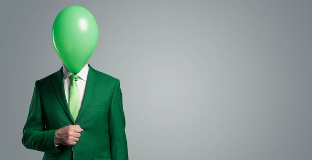 istock Anonymous businessman with a balloon in front of his head 1423965527