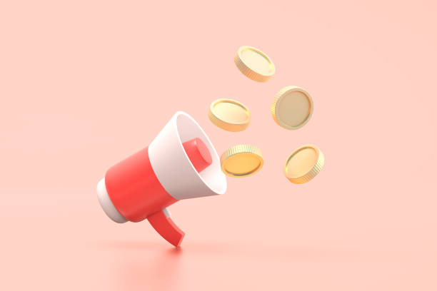 istock Coins come out of the megaphone. 1423970345
