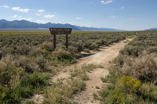 The 1860-1 Pony Express Trail wanders through the sagebrush valleys with Toquima Range in the background outside Austin, Nevada along Highway 50, the “loneliest road in America.”