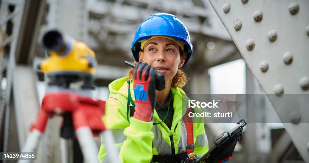 Female Steel Surveyor Stock Photo - Download Image Now - Construction Site, Construction Worker, Construction Industry