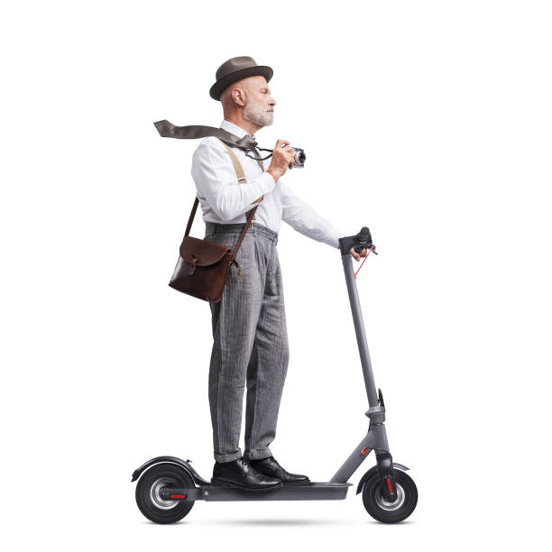 istock Vintage style photographer riding a scooter 1423975870