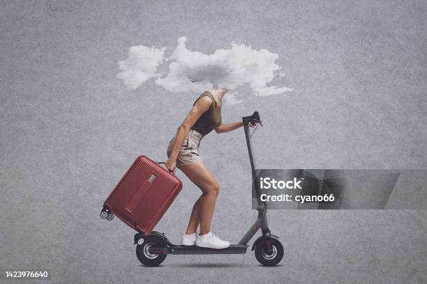 Woman With Head In A Cloud Riding A Scooter Stock Photo - Download Image Now - Brain Fog, Fog, One Woman Only