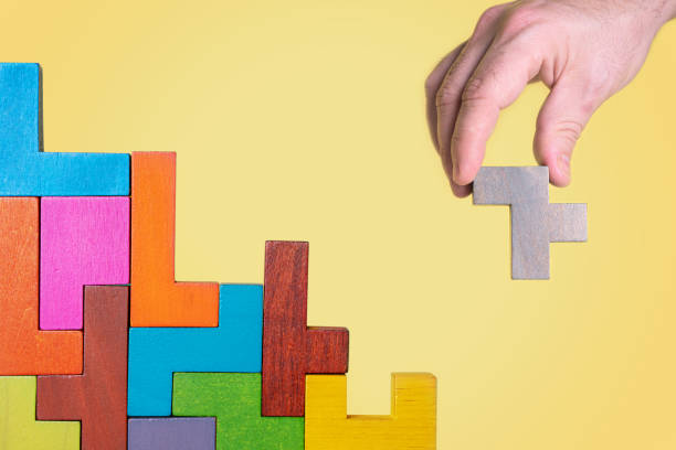 istock Abstract construction from wooden blocks. Concept of decision making process 1423977044