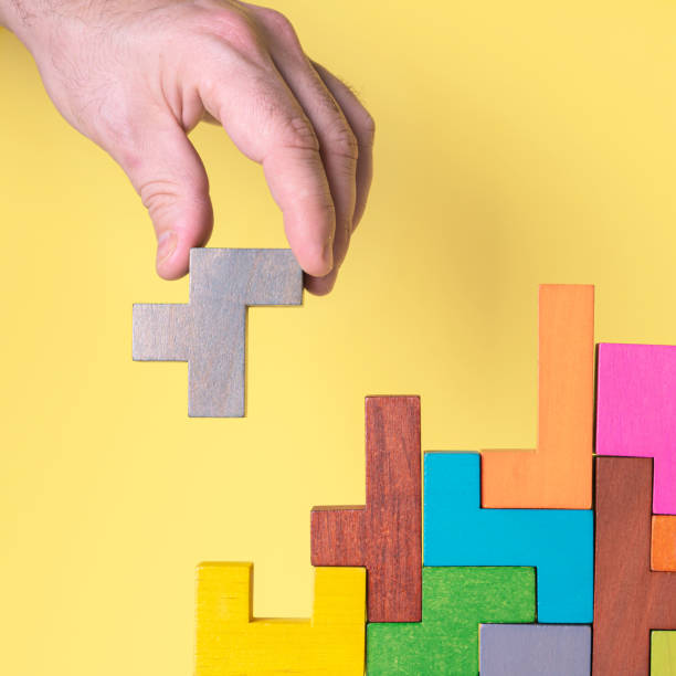 istock Abstract construction from wooden blocks. Concept of decision making process 1423977046