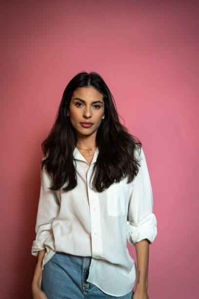 istock Young woman on a pink background 1423982212