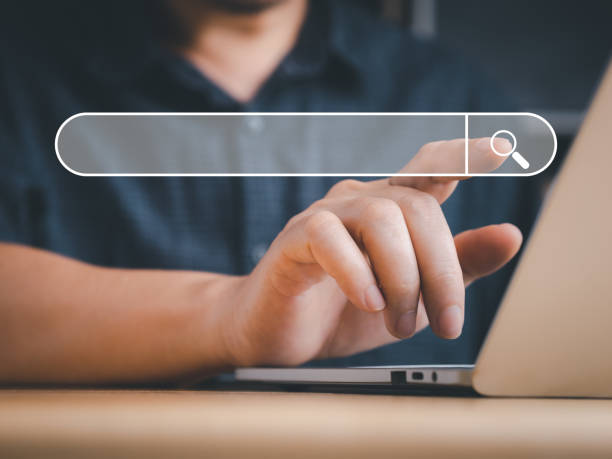 istock Business man searching or finding via internet. 1423982678